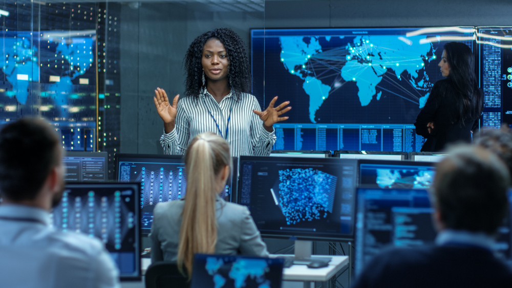 Change leader discussing tech-enabled transformation with a group
