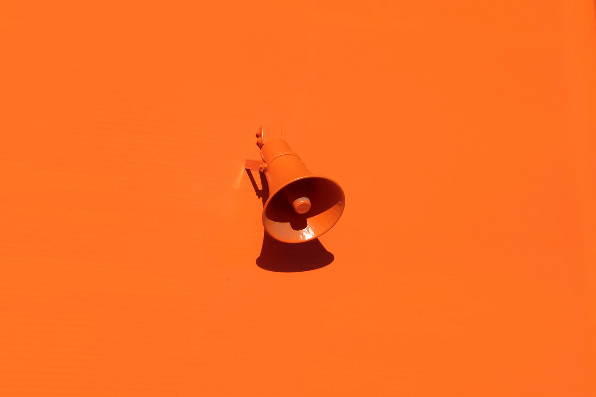Orange Megaphone symbolising change communications breaking through the noise
