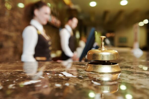 Hotel Reception counter with bell in foreground