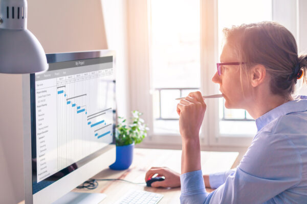 A beginner works on her first change management project with confidence
